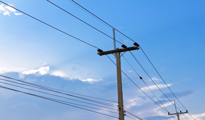 electric pole power lines and wires with blue sky